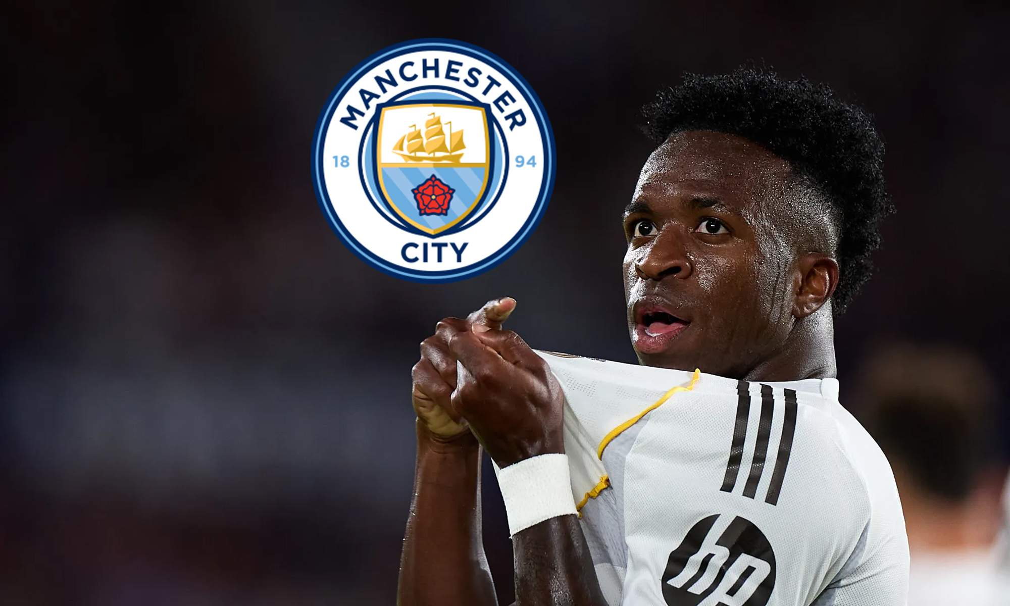 Vinícius Júnior cogiendo el escudo del Real Madrid y al lado el del Manchester City.